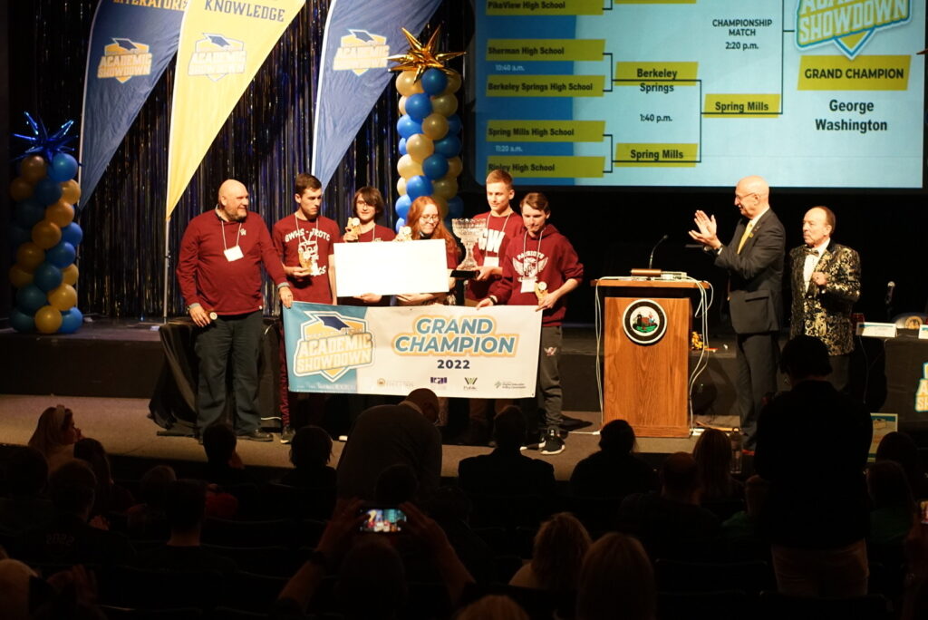 George Washington High School students stand on stage at the West Virginia Culture Center accepting an award.
