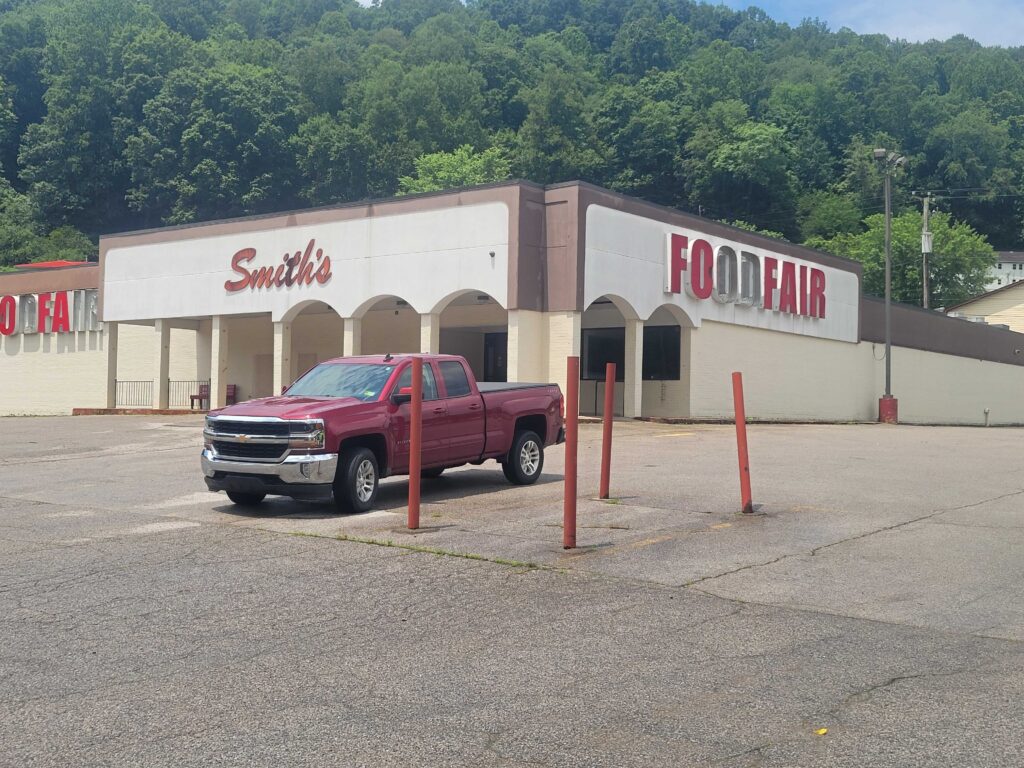 A truck is parked outside a grocery store in Elkview, West Virginia.