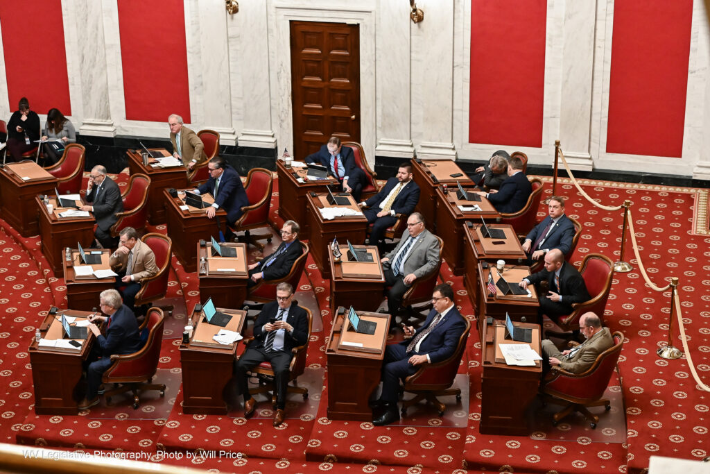 West Virginia Senators sit at their desks during a Saturday session.