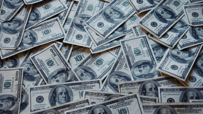 A large pile of banknotes, cash