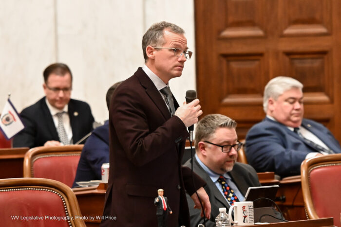 A man speaks into a microphone.