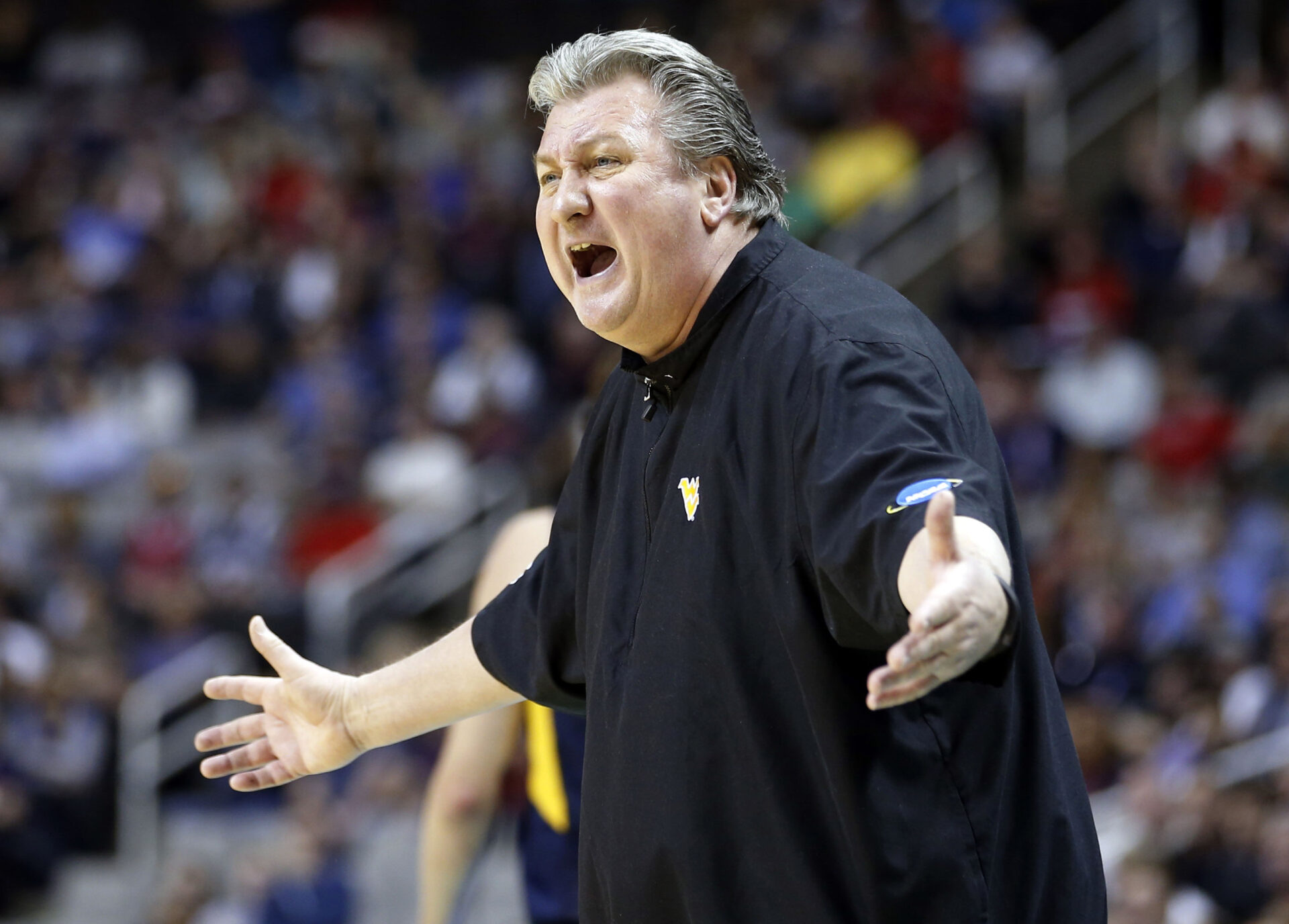 In this March 23, 2017, file photo, West Virginia head coach Bob Huggins yells from the sideline during the first half of an NCAA Tournament college basketball regional semifinal game against Gonzaga in San Jose, Calif.