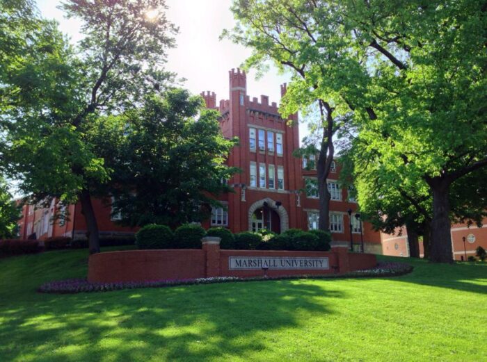 Big, older college building in a campus setting