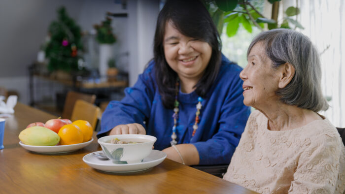An older daughter helps and gaining parent.