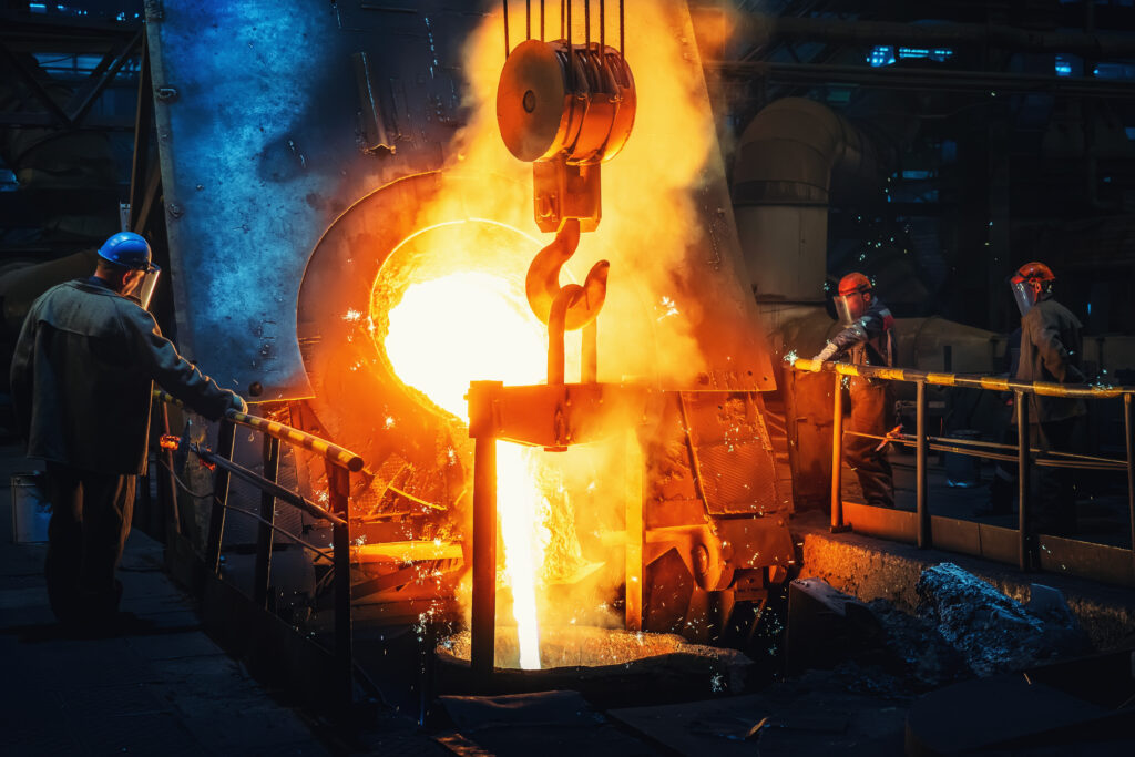 Molten steel pouring into a vessel.