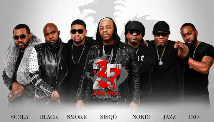 A row of Black musicians in stage outfits
