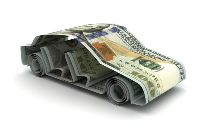 Dollar bills rolled up to look like a car.