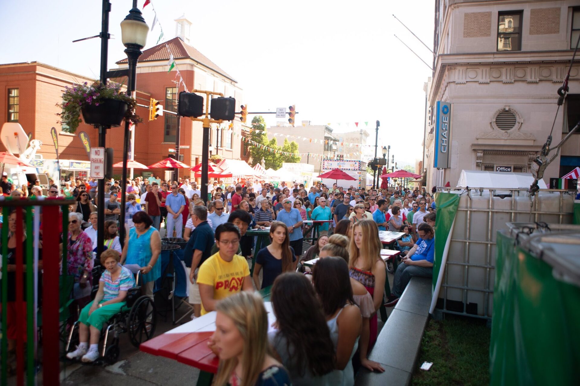A crowd of people in a Clarksburg street for a festival.