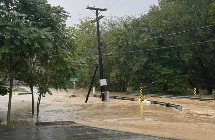 A road washed out by heavy floods.