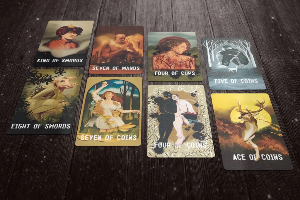 Six tarot cards are seen on a table.