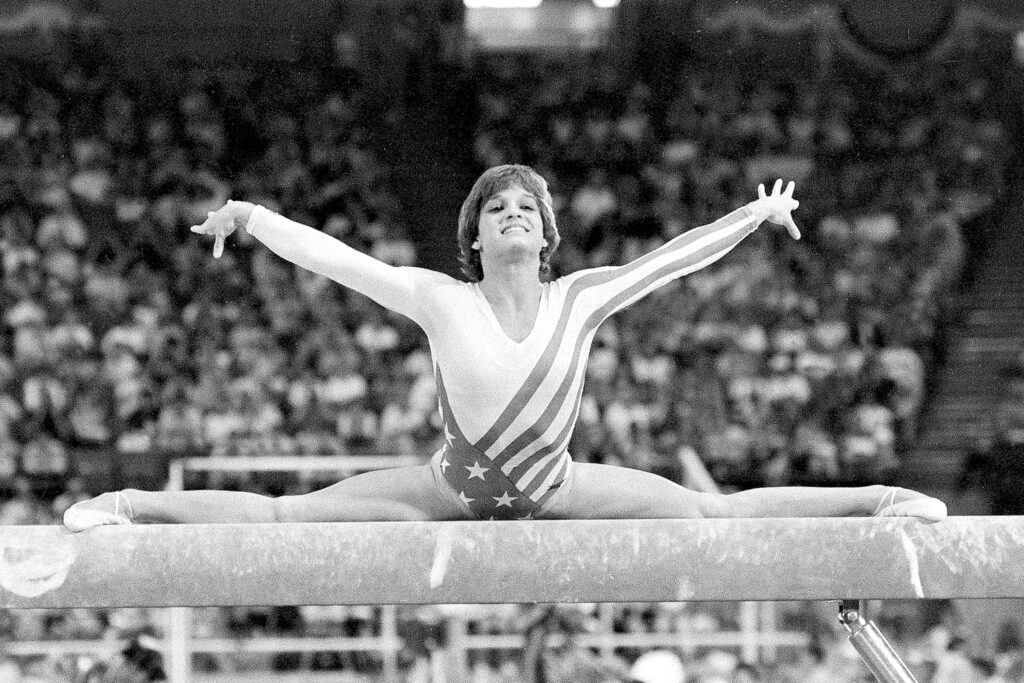A black and white photo of Mary Lou Retton at the 1984 Summer Games in Los Angeles.