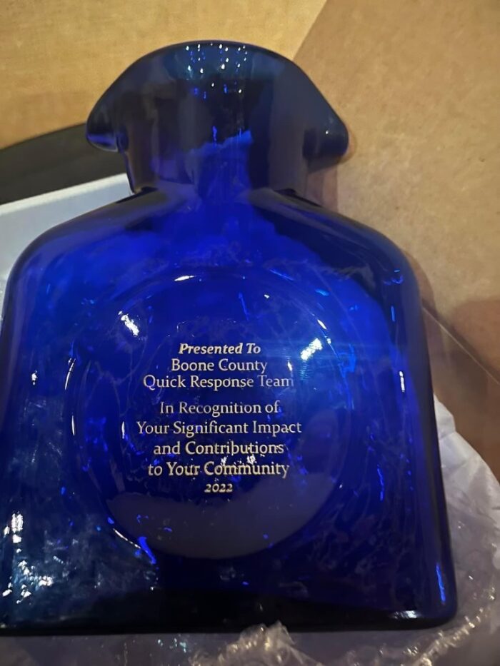 Blue glass vase that reads, "Presented to Boone County Quick Response Team. In Recognition of your Significant Impact and Contributions to Your community 2022."