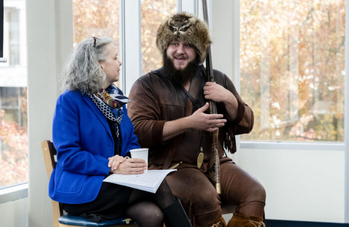 Rosemary Hathaway, author of the upcoming book about the Mountaineer, talks with Timmy Eads. The two were speaking at WVU about history and culture of the mascot.