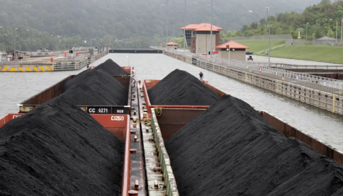 Five barges full of coal being transported along the Kanawha River in Marmet, W.Va.. The coal is headed to a power plant. 