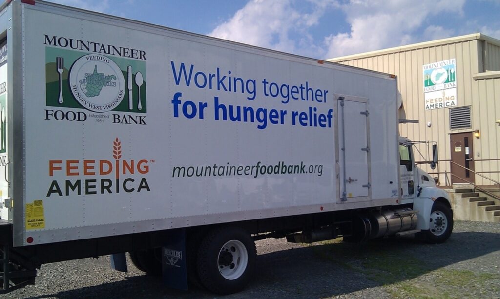 Big 18 wheeler truck with Mountaineer Food Bank written on the side.