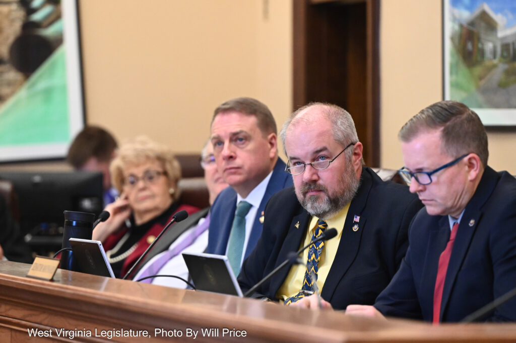 From left, Sens. Donna Boley, R-Pleasants, Rollan A. Roberts, R-Raleigh, Vince Deeds, R-Greenbrier, Jay Taylor, R-Taylor, and Mark Maynard, R-Wayne, sit behind a bench desk in the Senate Education Committee room Jan. 30, 2024.