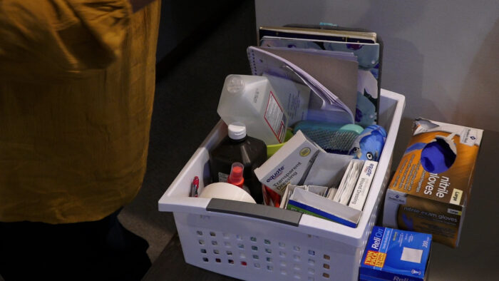 Medical supplies are shown in a white carrying basket.
