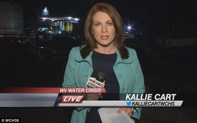 A woman with brunette hair and wearing a light blue blazer talks on TV screen in a news report.