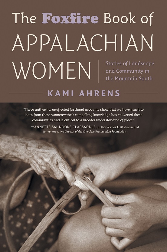 A book cover is shown. It's tan and gray in color. The title reads "The Foxfire Book of Appalachian Women," and features two sets of hands working. 
