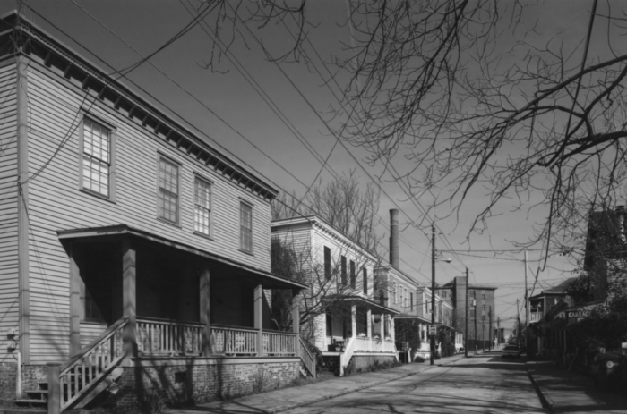 A black and white photo of a small town.