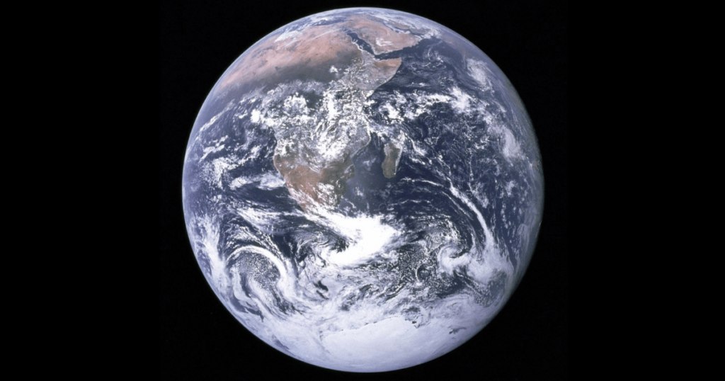 The famous "Blue Marble" image from NASA shows a wide view of Earth from space. A circle is set against a black backdrop