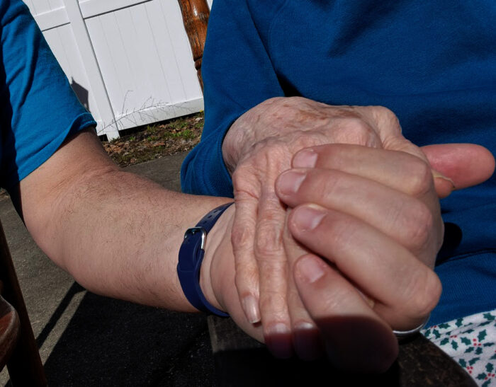 A close up of two clasped hands.