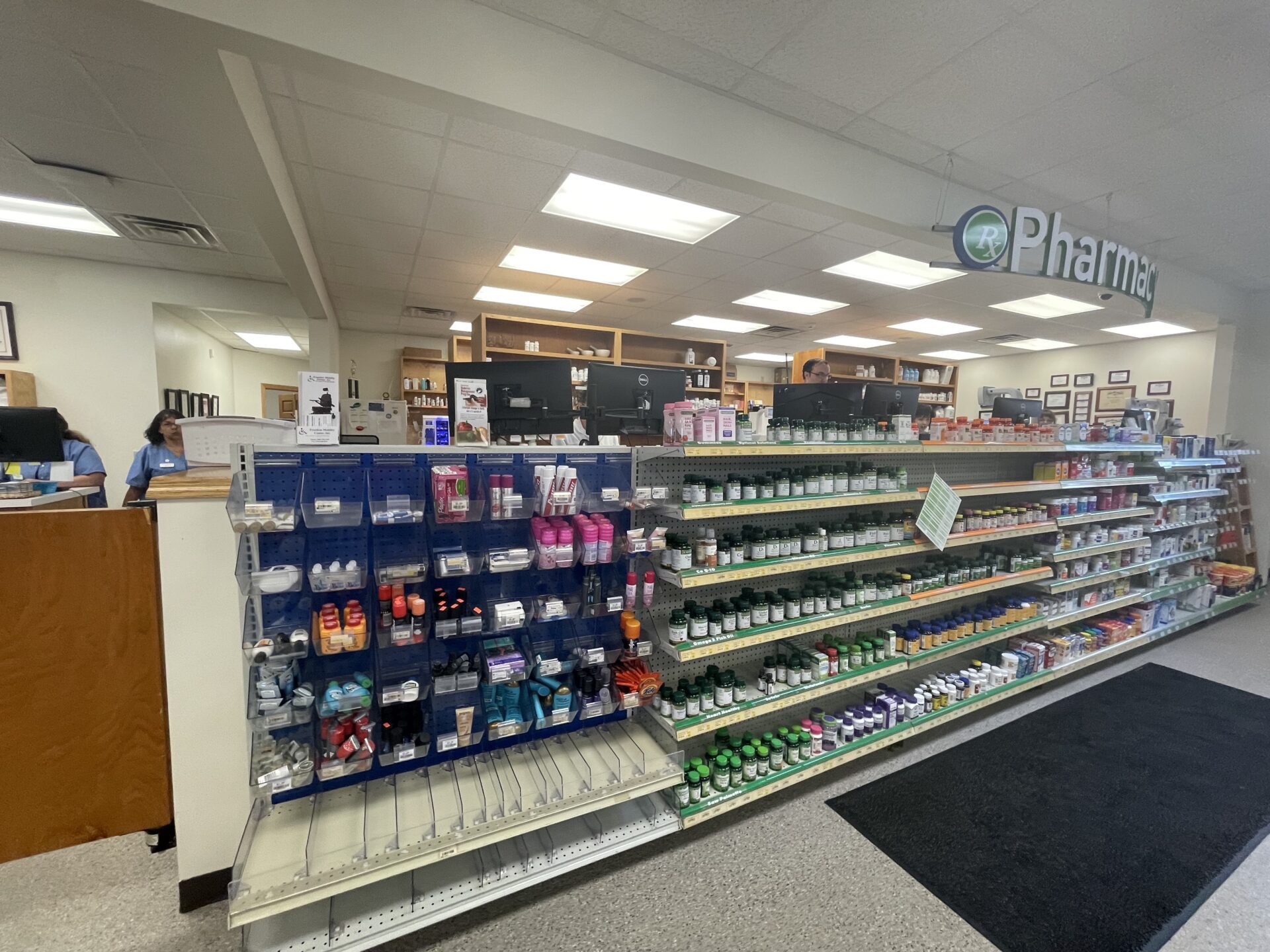 a pharmacy has lined walls of supplements.