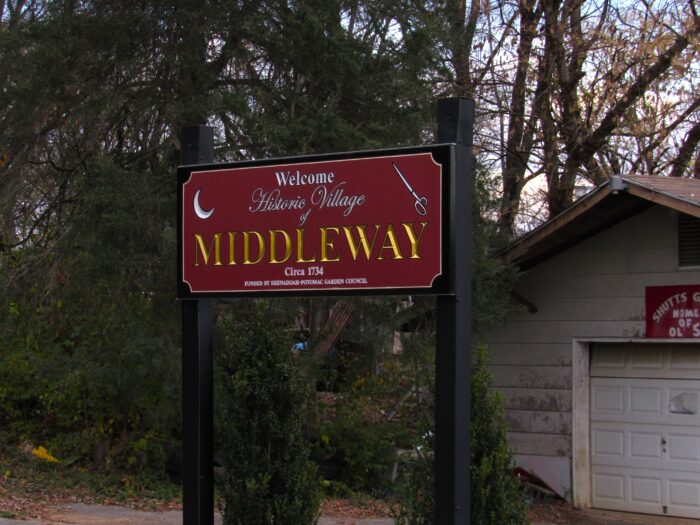 A sign reads "Welcome Historic District of Middleway."