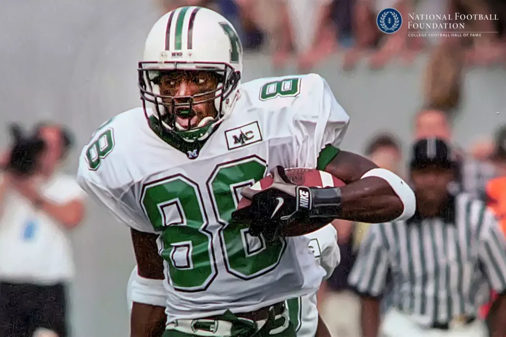 Football Player, number 88 on jersey, holding the ball.