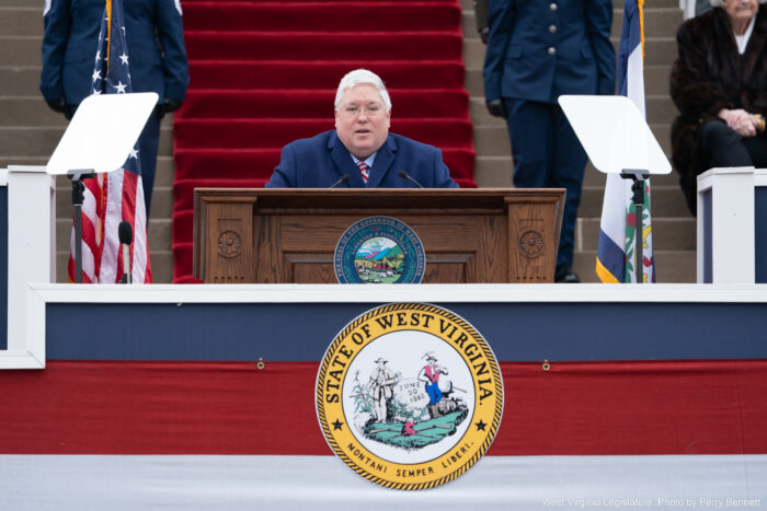 man standing at a podium giving a speech.
