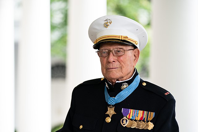 Elderly man in Marine uniform.