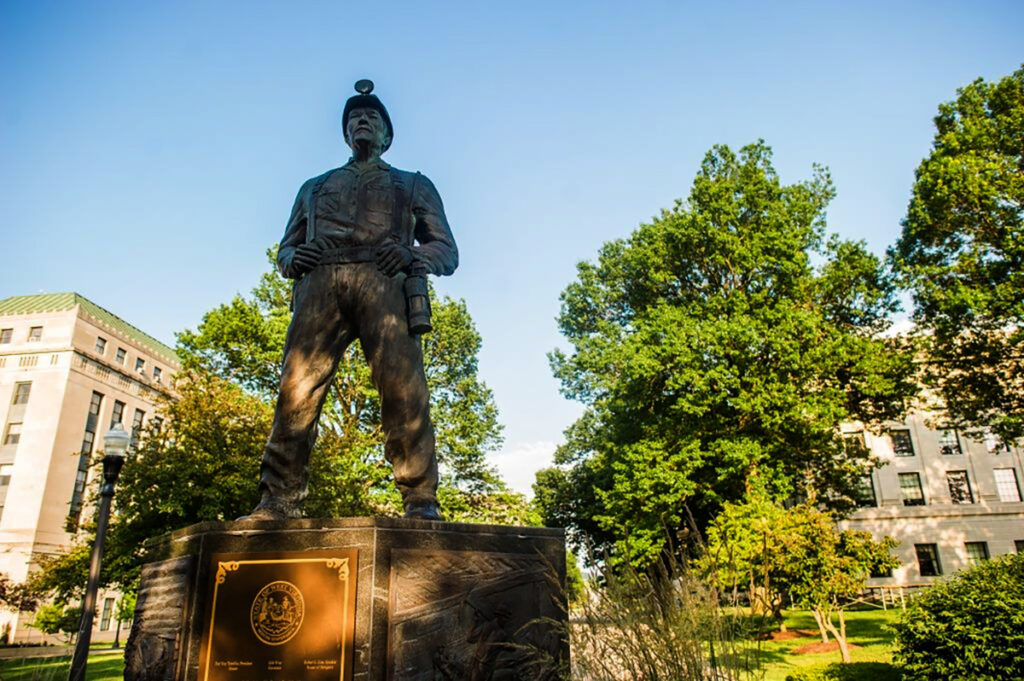 statue of man in coal miner gear