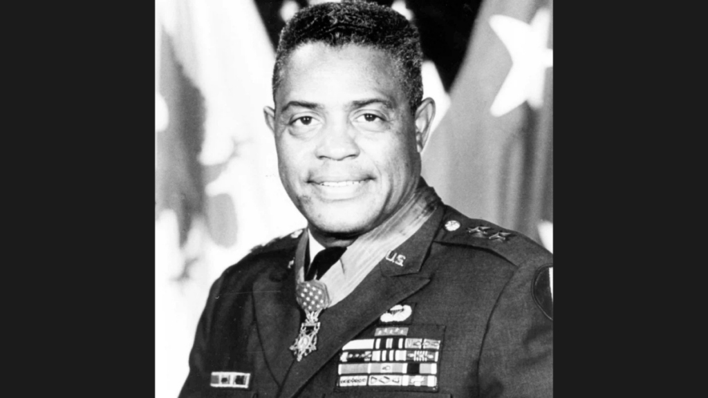 Black and white military photograph of a Black man. He wears several awards including the Medal of Honor.