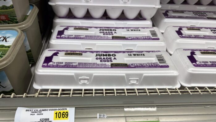 A dozen eggs at a grocery store.