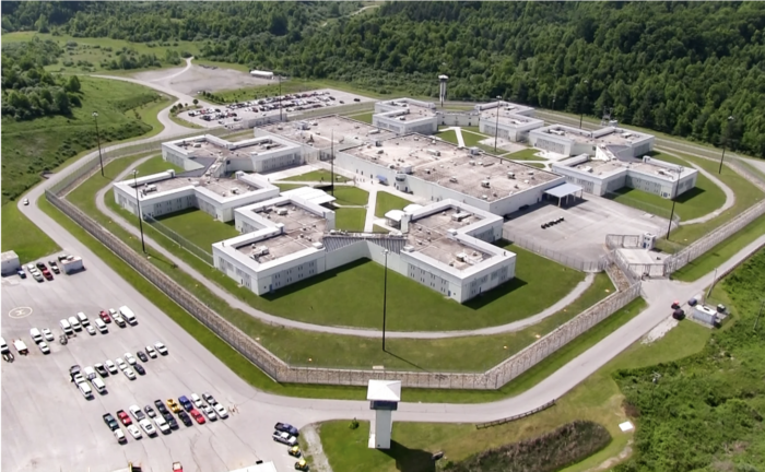 An aerial photo of a prison that is divided into five sections.