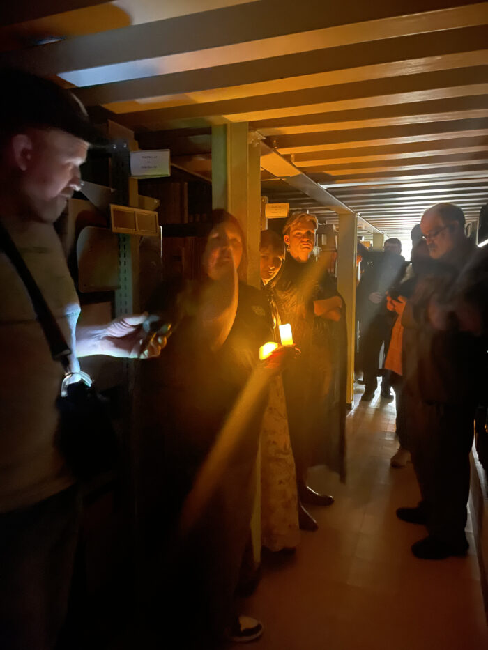 Seven people are shown on a tour.
