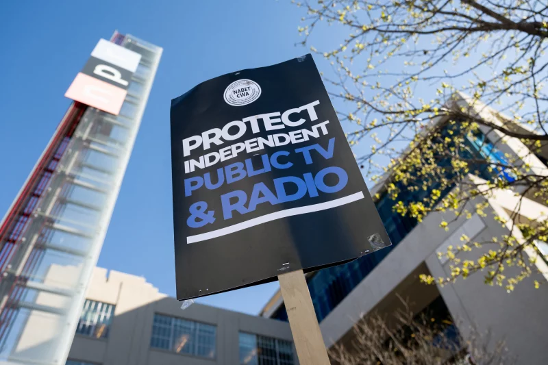 A close up of a sign that reads, "Protect Independent Public TV & Radio."