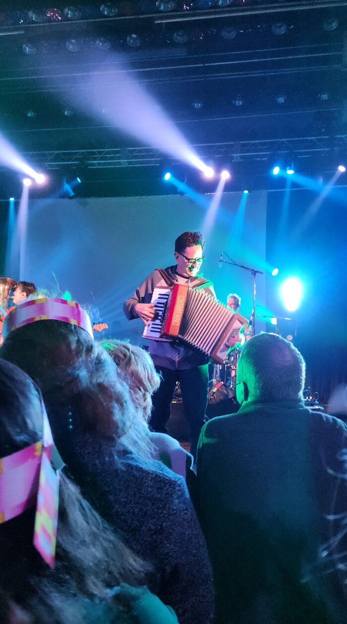 A photo taken from the audience for a musician performance.