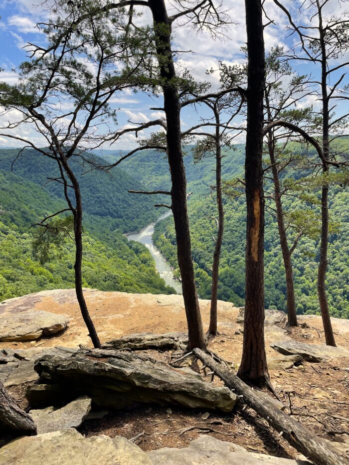 A photo from the top of a mountain on a sunny day.