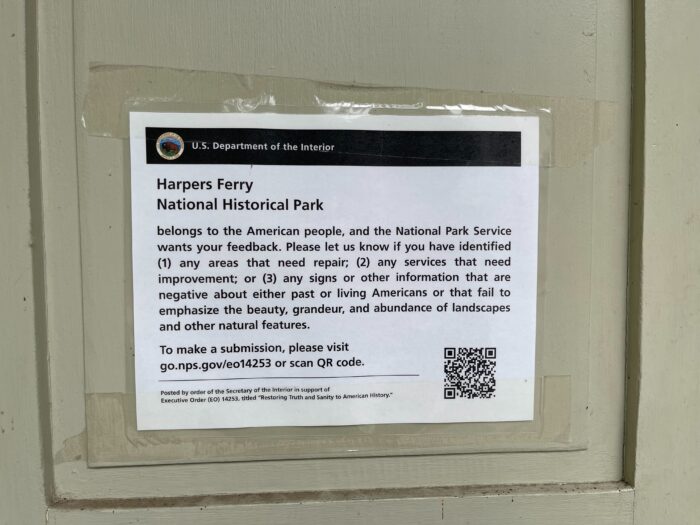 A close up of a sign just outside the public restrooms at the Harpers Ferry National Historical Park.