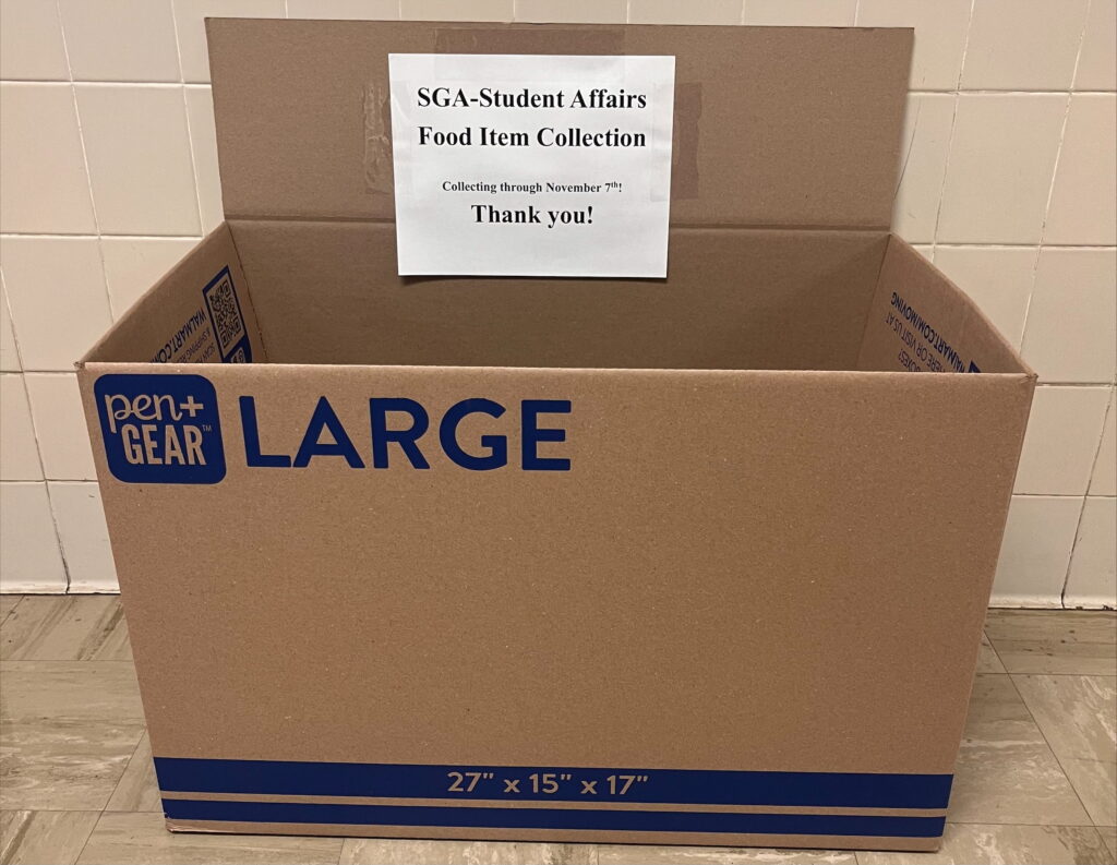 Large rectangular box with a white sign