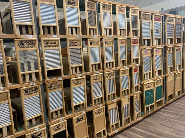 A wall full of washboards, which look like a wooden board with crimped metal.