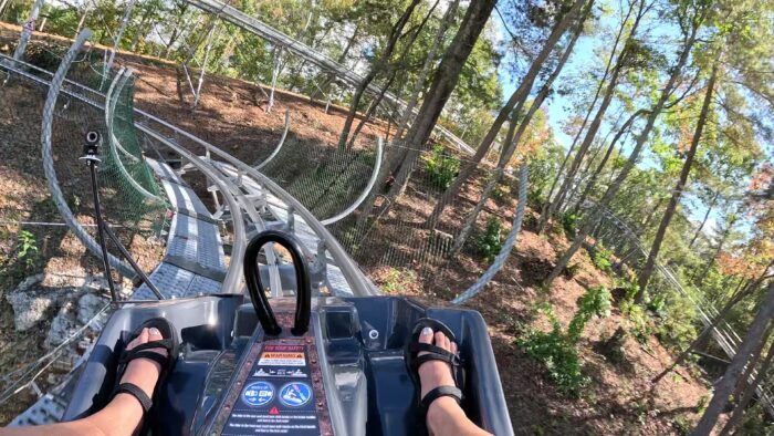Feet in a car on a stainless steel track
