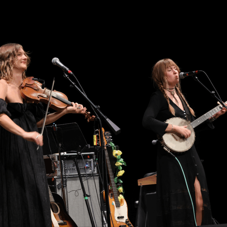 two women play the fiddle and banjo
