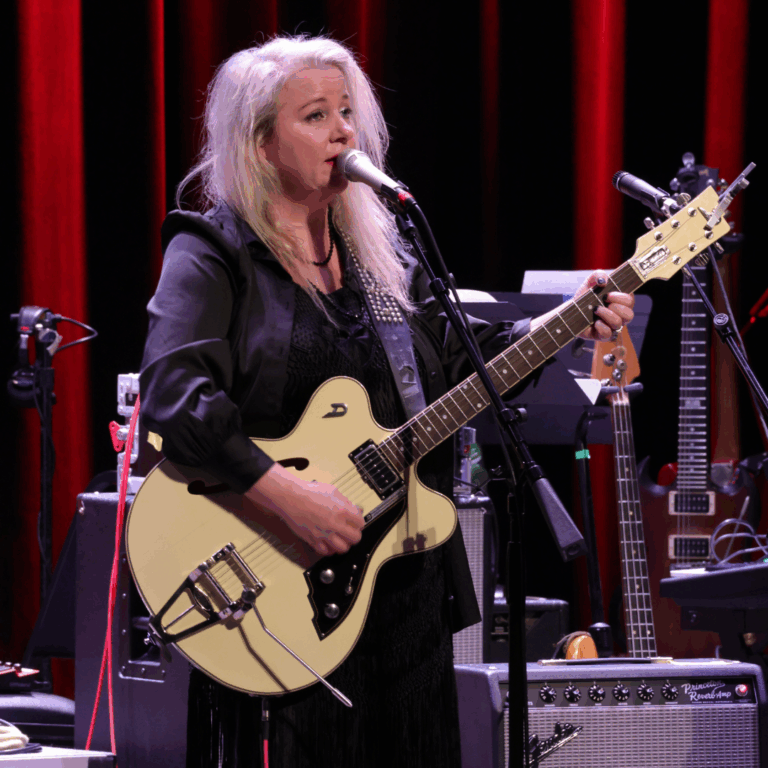 woman plays guitar