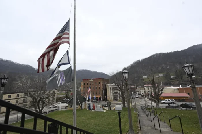 A flag shown is at half-staff in Webster Springs.