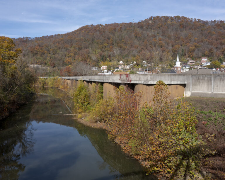 Outside Williamson, faraway shot, a river is shown.