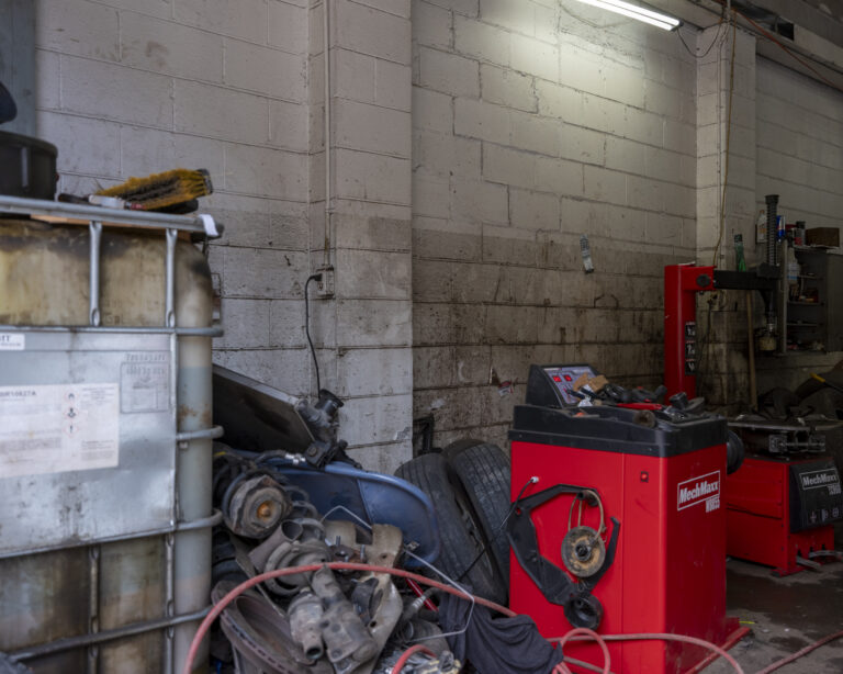 Inside a garage that has been damaged by flooding.