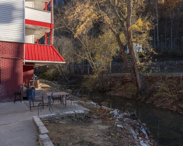 Outside a red apartment.