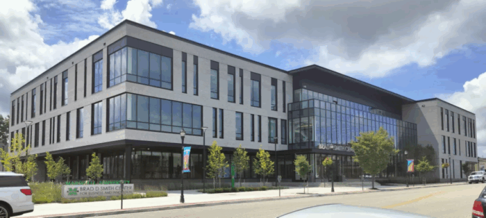 Outside a large building on a cloudy day.